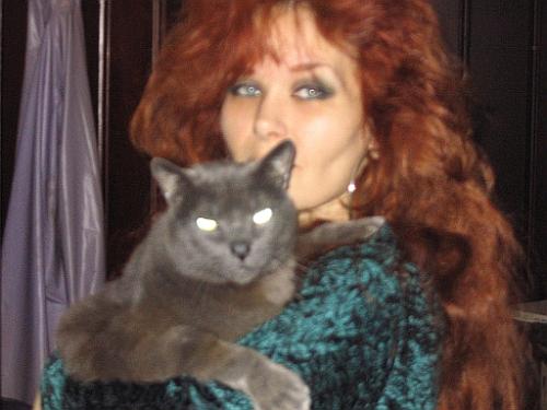 my self and one of my cats - i know the shot's a little fuzzy.. but the cat is my russian blue baby.he is 34 pounds :)