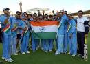 rejoicing indian cricket team - AFter winning the tournament, they are posing for photo with our national flag.