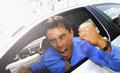 Road Rage! - A man with road rage shaking his fist.