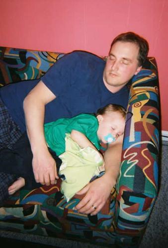 a man sleeping with his child - a man sleeping with his child, it is make parents so happy if theire children sleep with them.