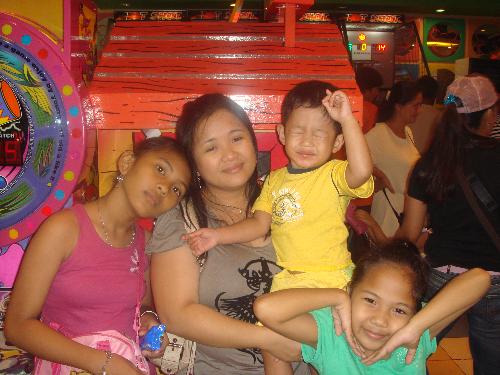My sister and my nieces and nephew - These is my extended family. My sister, my two niece and my nephew.They're having a good time at the mall.
