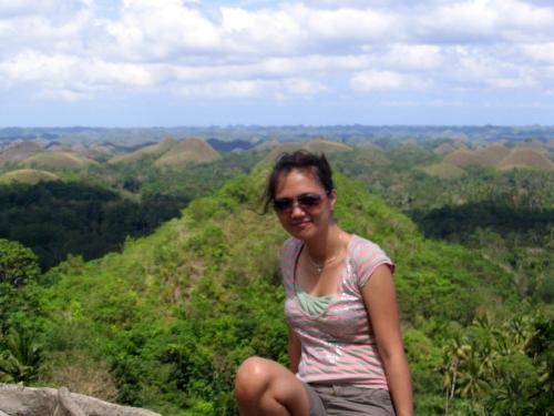 Bohol, Philippines - The Chocolate Hills is an unusual geological formation in Bohol, Philippines.[1] It is composed of around 1,268 perfectly cone-shaped hills of about the same size, spread over an area of more than 50 kilometers². They are covered in green grass that turns brown during the dry season, hence the name.  The Chocolate Hills is a famous tourist attraction of Bohol. It is featured in the provincial flag and seal to symbolize the abundance of natural attraction in the province.[2] It is also in the Philippine Tourism Authority's list of tourist destinations in the Philippines. Sometimes considered the 'Eighth Wonder of the World',[3] it has been declared the country's 3rd National Geological Monument and proposed for inclusion in the UNESCO World Heritage List.