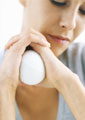 woman holding a stress ball - This picture shows that you can also use stress balls to release stress.
