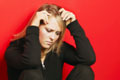 problematic - This woman is sitting on the stairs, trying to think things over.