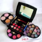 Make-up - A Make-up box showing different shades of eyeshadows, compacts and blushers.