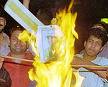 Indian spectators burning the posters - cricket fans burning posters of indian players