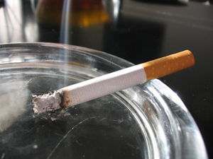 Smoking - An image portraying the use of smoking cigarettes.