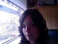 me with curly hair - my sister did this to me:D can't really see me, but i did look pretty coming from me lol