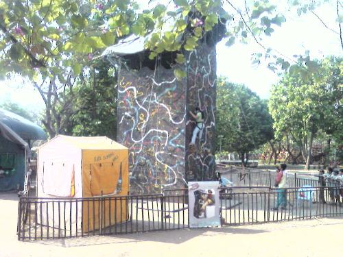 Thats me!! - Thats me, rock climbing. This picture is taken from an amusement park in Mumbai, India. It was the first time that i tried my hand at rock climbing. To tell you people honestly, it is difficult for a first-timer. It needs strong hands and legs. I was surprised when i finished the 30 feet. and i would love to do it over and over again.