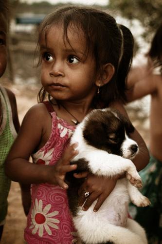 Child & her Puppy! - Taken in Camobodia along the river.