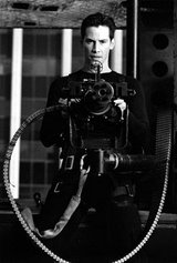 matrix 2 - this pic illustrates the usage of various high tech weapons by the hero of the matrix in the film.