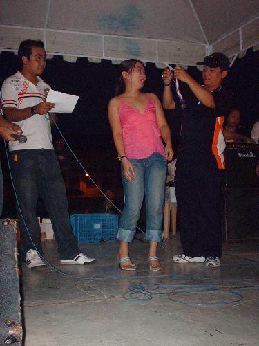 The Runner - I always love to race using my own feet. Yup! I love to run. I wasn't able to get a photo of me running in that oval but I sure snagged a picture of me accepting my award for winning the 100 meter dash for women on the company's Sports Fest last December 2006. Hmm... I guess I'll run again this year...