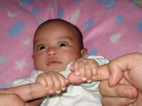 Nice hand grip. - Our baby with a nice, tight grip on daddy and mommy's hands.