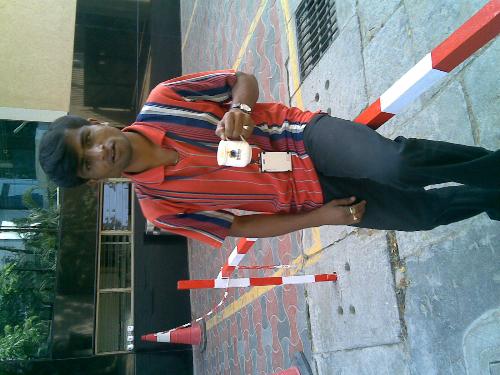 Me in red - Me in red near no parking area along with tea cup