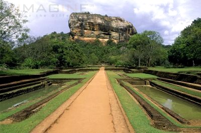 sri lanka - this is the mount sigiriya. it is where the old castle was built a hundred years ago. it is almost 2400 feet high. you can climb this easily because the people built stairs for easy climbing. most of the tourists do climb this mountain. 