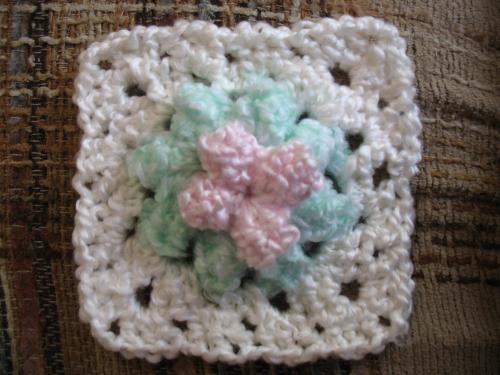 Dogwood Square  - Dogwood Granny square - I made some squares like this and some solid cream squares and created a pretty baby blanket. I have not written the pattern yet but will some time. I'll showthe finished product as well in another picture. This was donated to the Zellweger Baby Support Network to be auctioned for a fund raiser.