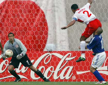 imagin football match - this photo show the ability of the football player they do any thing in the match. footballer jump on he head in the match..