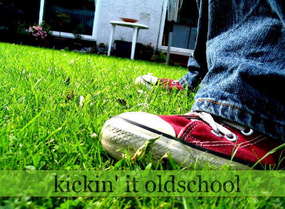 kickin it oldschool - well this is just a layout pic for a website but i like it it shows a red shoe (converse i belive) on gras with the words Kickin it oldschool below