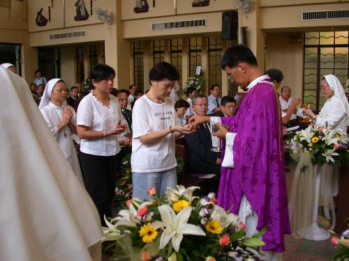 The Holy Communion - People lined up to receive Holy Communion..