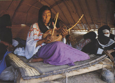 Touareg moman playing traditional violin - Tuareg's are people living in the desert in Agadez 'the north side of my country).Their women used to play traditional violin on ceremonies.