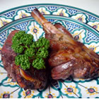 Roast Leg of Lamb with Rosemary - Original recipe yield: 6 to 8 servings PREP TIME: 15 Min COOK TIME: 1 Hr 20 Min READY IN: 1 Day 1 Hr 35 Min INGREDIENTS: 1/4 cup honey 2 tablespoons prepared Dijon-style mustard 2 tablespoons chopped fresh rosemary 1 teaspoon freshly ground black pepper 1 teaspoon lemon zest 3 cloves garlic, minced 5 pounds whole leg of lamb 1 teaspoon coarse sea salt DIRECTIONS: 1. In a small bowl, combine the honey, mustard, rosemary, ground black pepper, lemon zest and garlic. Mix well and apply to the lamb. Cover and marinate in the refrigerator overnight. 2. Preheat oven to 450 degrees F (230 degrees C). 3. Place lamb on a rack in a roasting pan and sprinkle with salt to taste. 4. Bake at 450 degrees F (230 degrees C) for 20 minutes, then reduce heat to 400 degrees F (200 degrees C) and roast for 55 to 60 more minutes for medium rare. The internal temperature should be at least 145 degrees F (63 degrees C) when taken with a meat thermometer. Let the roast rest for about 10 minutes before carving.