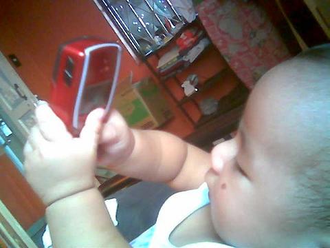 my baby playing with cellphone - look at this, he is so adorable and cute!