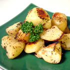 Oven Roasted Potatoes - Original recipe yield: 4 servings PREP TIME: 15 Min COOK TIME: 30 Min READY IN: 45 Min   INGREDIENTS: 1/8 cup olive oil 1 tablespoon minced garlic 1/2 teaspoon dried basil 1/2 teaspoon dried marjoram 1/2 teaspoon dried dill weed 1/2 teaspoon dried thyme 1/2 teaspoon dried oregano 1/2 teaspoon dried parsley 1/2 teaspoon crushed red pepper flakes 1/2 teaspoon salt 4 large potatoes, peeled and cubed  DIRECTIONS: 1. Preheat oven to 475 degrees F (245 degrees C). 2. In a large bowl, combine oil, garlic, basil, marjoram, dill weed, thyme, oregano, parsley, red pepper flakes, and salt. Stir in potatoes until evenly coated. Place potatoes in a single layer on a roasting pan or baking sheet. 3. Roast for 20 to 30 minutes in the preheated oven, turning occasionally to brown on all sides.
