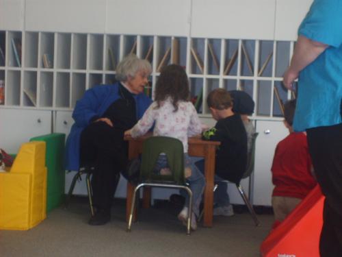 teacher  - teacher helping build a puzzle at p.a.t. 