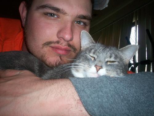 My husband & my cat 'Puss' - This is a pic of my husband & my kitty. She likes him way more than she likes me, but i wouldn't take a million dollars for her.