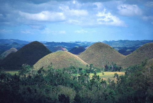 Chocolate Hills  - This is one of the beautiful spots that can be found in Bohol, the Chocolate Hills, the province signature attraction and pride,These are the collection of cone-shaped hills that during summer, the dome-shaped grass turn brown,transforming the area into seemingly endless rows of chocolates, that when it rains, it melts...