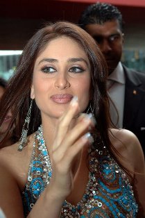 photo - at the awards functions entrance , waving to the fans