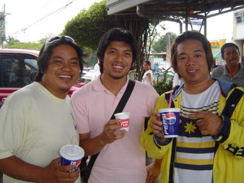 Breaking for a gulp - Puerto Princesa City, Palawan Philippines  After a long day of rehearsals for the local festivities, my cousins and I decided to take a chill at the town center. Soda and Caffeine. Ahh time to strike a pose!
