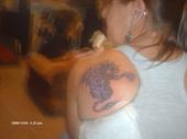 My second tattoo - I have an almost fanatic love of mystical things. Dragons and wizards are my very favorite. I love them so much, I decided to have a dragon tattooed on my left shoulder blade. It came out really awesome and my tattoo artist ROCKS!