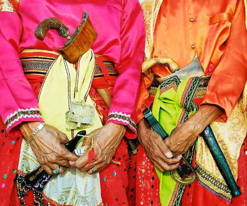 The 5th Gender & Launching War in Iraq - Traditionally the mediums between kings and gods, Bissu priests represent a sort of 'fifth gender' in southern Sulawesi. In a part of the world that recognizes four genders -- a) men, b) women, c) men who live as women and d) women who live as men -- the Bissu priests fit e) none (or all?) of the above.  Gentle and endearing, their administrative duties are now largely restricted to wedding ceremonies, where they dance and impale themselves with their kris daggers, yet somehow remain uninjured. Their free time is spent practicing a mixture of animism and ancient mystical Islam, traditions now largely forgotten as more and more Indonesians rack up frequent flyer miles on pilgrimage to Mecca.  I shot these priests at a royal wedding in Pare Pare, alongside a documentary film crew in March 2003. As George W. Bush penetrated Iraq, our gaggle of Americans penetrated a devoutly religious corner of the world's largest Muslim population with concern and heavy hearts. By day three, the roaming wedding commentator (who announced the festivity's play-by-play over loudspeaker) brought the crowd to a hush. It was the ceremony's culmination, when the bride and groom approached to meet for the first time in their lives. 'Ladies and Gentlemen,' whispered the announcer, fixing his stare on me as the terrified teens sized one another up, 'At this moment all I can say is... I am so glad our friends from America are here!!' Onlookers erupted and slapped me on the back and I knew I would never feel unwelcome in this country, though I sometimes wonder why not.