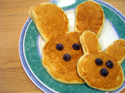 Bunny Pancakes..click for DIRECTIONS - Making Bunny Pancakes Using any pancake batter:  Spoon scant 1/2 cup batter into a hot seasoned skillet. With back of spoon, gently spread batter into 4-inch circle. Spoon about 2 tablespoons batter onto top edge of circle for head. Using back of spoon, spread batter from head to form bunny ears. Cook until bubbles appear and break on top of pancake. Turn over and cook until done 1-2 minutes. Decorate face with berries and serve.