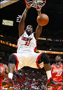 Shaq Attack - Shaq slams the ball with his thunderous dunk.