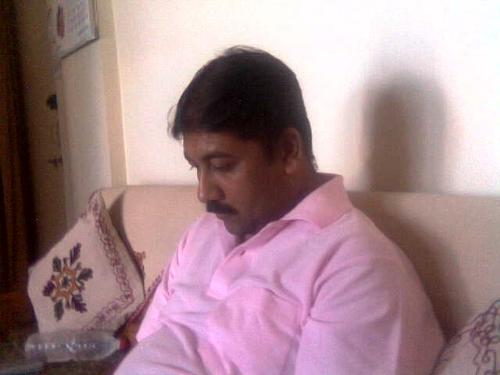 Me engrossed playing game - Taken by a friends daughter when I was solving puzzle for her.I like the picture for its clarity