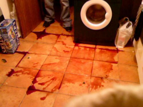 oops! - Looks like the scene of some washing-machine-gone-bad freak accident, but it's actually just a smashed bottle of red wine... there was no bloodshed at the hands of this washer!