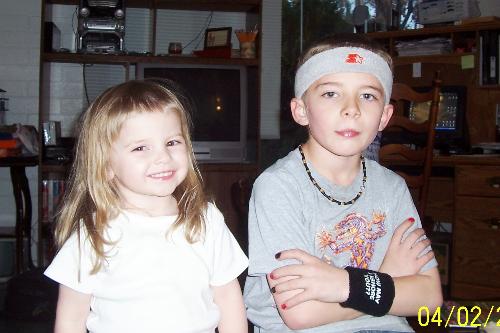Two of my wonderful children - These are my biological children. (My fiancé also has two biological children.) We consider all of them 'ours', though! This is when they were 2 and 8. What a little rocker my boy is, eh?!