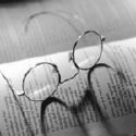 Glasses - Old style glasses put over a book