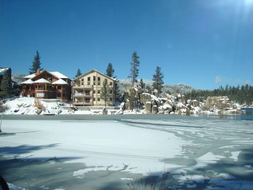 Big Bear Lake 2007 - This is a picture of the homes in the Boulder Bay area of Big Bear Lake, California. We went up there for a small vacation in January and it snowed ALOT our last night. This was taken on our drive home down the mountain. I thought it was pretty with the snow on the rocks and the lake has a thin layer of ice as well.