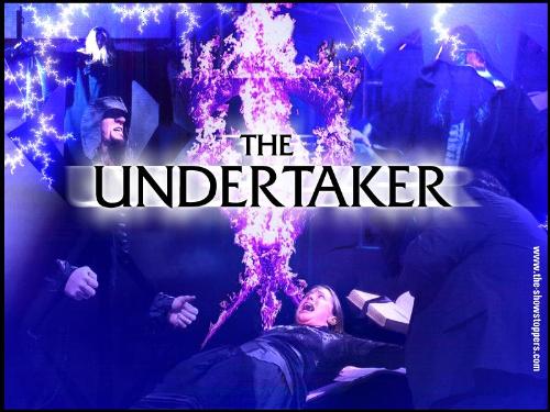 The Lord Of Darkness at his Evil Best - The Undertaker at is Evil Best , here hs is seen sacrificing WWE Chairman Vince McMahon's daughter, Stephanie McMahon being sacrificed on the Undertaker's symbol................