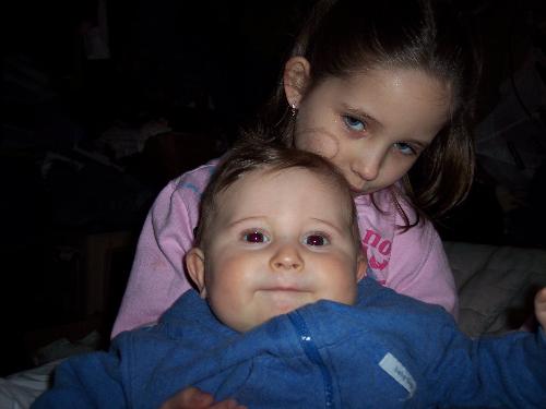 Kya and Giovanni - the sweet little darlins wrestling on gramma's bed