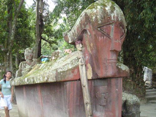 400 years old grave - legend has it, this stone grave is 400 years old, and that the stone is red in colour not because of painting but because of the blood and ppl had to use magic to bring this heavy stone up from the mountain, to where it is now