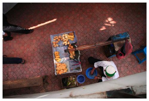 Portable restaurent. - Are you hungry? Fried tofu and bananas ready for take out. Street food is the highlight of any trip to indonesia.   This picture was taken from the overpass crossing jalan asia africa in front of the post office.