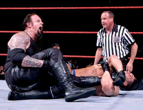 The Undertaker in Pain.......... - The Undertaker in action against Ken Shamrock...writhing in pain on being put into an Ankle lock by Ken Shamrock...the Undertaker has never tapped out & this was the closest he ever came to tapping out.....but.....