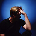 Depression - Man holding his head.