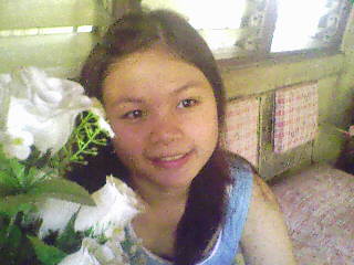 Where's the cam? - This one's taken in my house. I thought the camera was facing the other way so I looked the other way. I didn't realize I was facing the microphone that looked like tha camera.. So.. Smile! =)