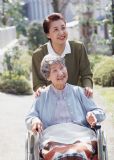 a woman with her mother-in-law - They are talking happily. They get along well with each other just as a mother and a daughter.