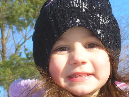 A Day in the Snow - This photo is of my grandchild Julia Marie, age 4 1/2. This photo was taken outside my daughters home, where Julia was taken sleigh riding, this January. She had the best time and you cantell this by her photo.